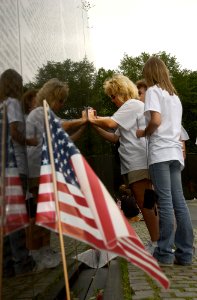US Navy 030616-N-9593R-149 Visitors to the Vietnam Veterans Memorial Wall, take rubbings of names