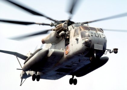 US Navy 030612-N-2972R-073 A CH-53E Super Stallion prepares to land on the flight deck to transfer elements from the Second Marine Expeditionary Brigade (2nd MEB) to the amphibious assault ship USS Bataan (LHD 5)