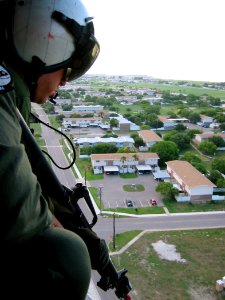 US Navy 030617-N-7780X-044 Aviation Electronics Technician 2nd Class prepares for an aerial assault on base security during a simulated attack
