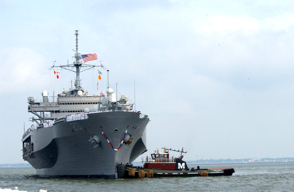 US Navy 030613-N-6607P-001 Tugboats assist the amphibious command and control ship USS Mount Whitney (LCC-JCC 20) to the pier