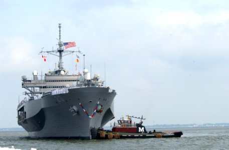 US Navy 030613-N-6607P-001 Tugboats assist the amphibious command and control ship USS Mount Whitney (LCC-JCC 20) to the pier