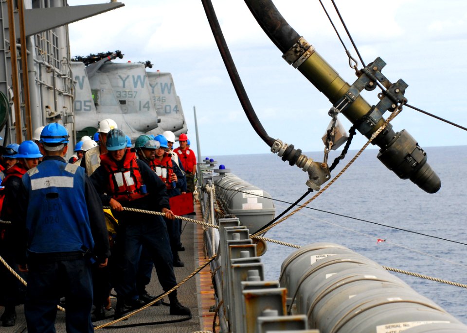 US Navy 081001-N-2183K-085 Crew members hoist the fuel probe to the guided-missile destroyer USS Halsey (DDG 97)