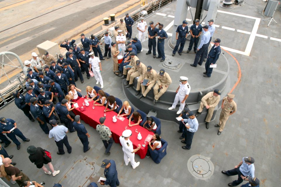 US Navy 030620-N-3228G-002 The National Football League's (NFL) San Francisco Forty-Niners cheerleaders sign autographs for Sailors aboard the guided missile frigate USS Reuben James (FFG 57)