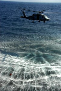 US Navy 100105-N-2600H-099 An SH-60B Sea Hawk helicopter hovers above a life jacket in the Gulf of Aden