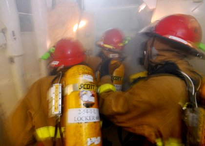 US Navy 081024-N-1038M-049 A hose team responds to a simulated class Alpha fire during a general quarters drill