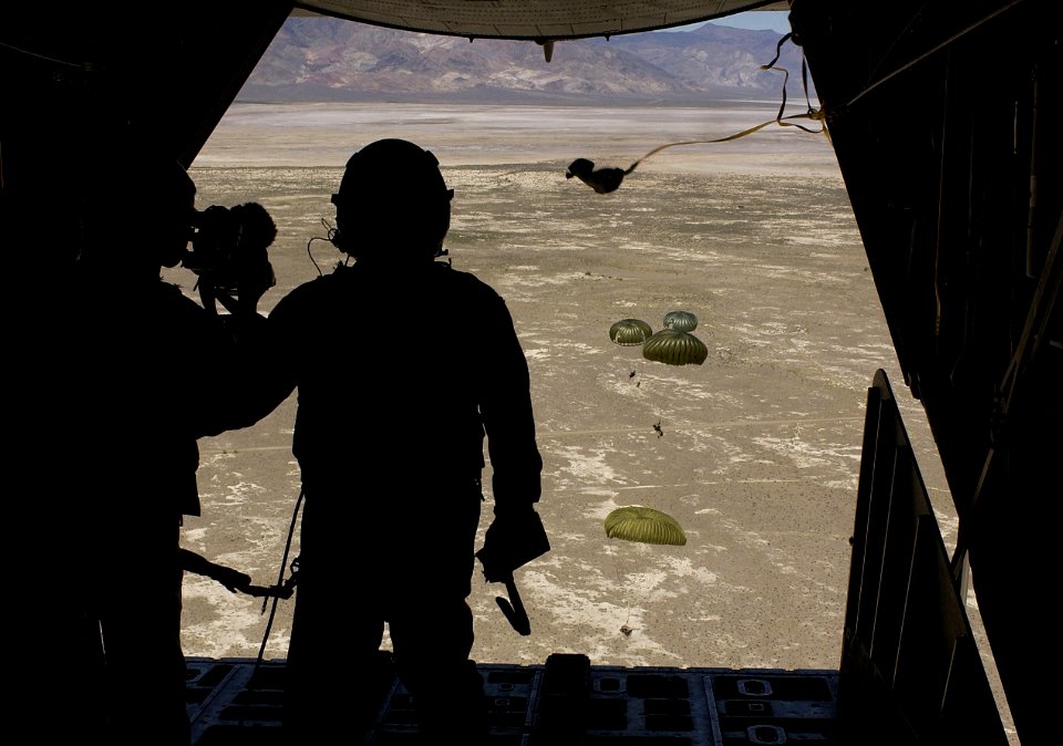 US Navy 030811-F-7823A-002 U.S. Air Force Pararescuemen from Moody Air Force Base Ga., prepare to parachute out of an HC-130 Talon II to secure a downed pilot