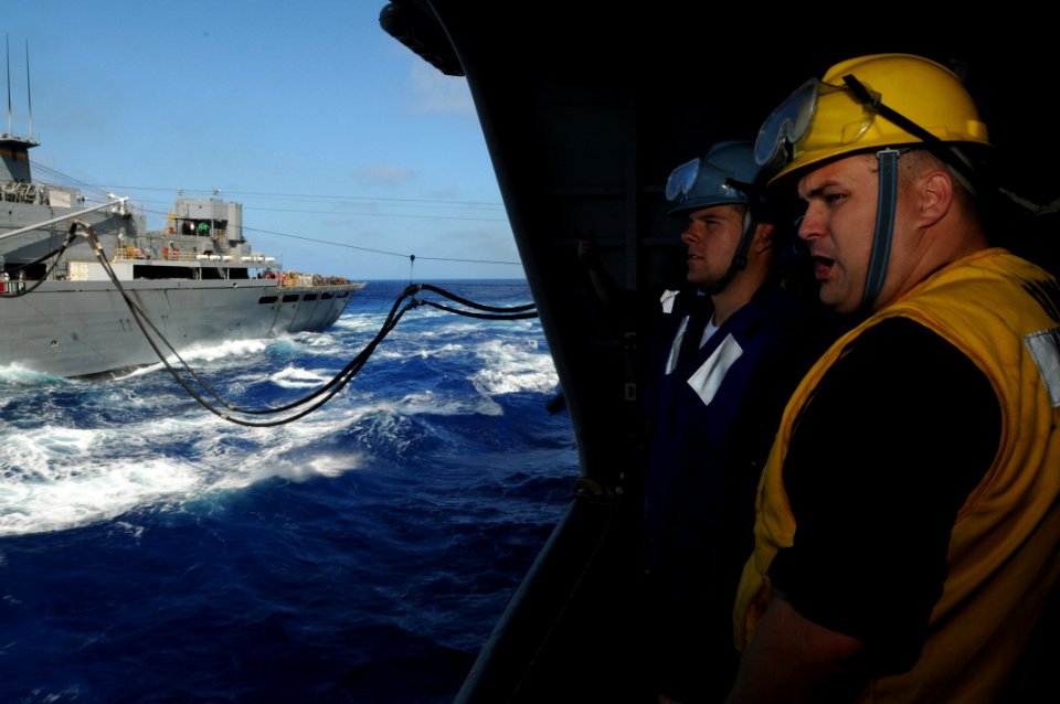 US Navy 090605-N-2344B-011 Boatswain's Mate 1st Class Noelle Barker briefs Seaman Steve Rowe