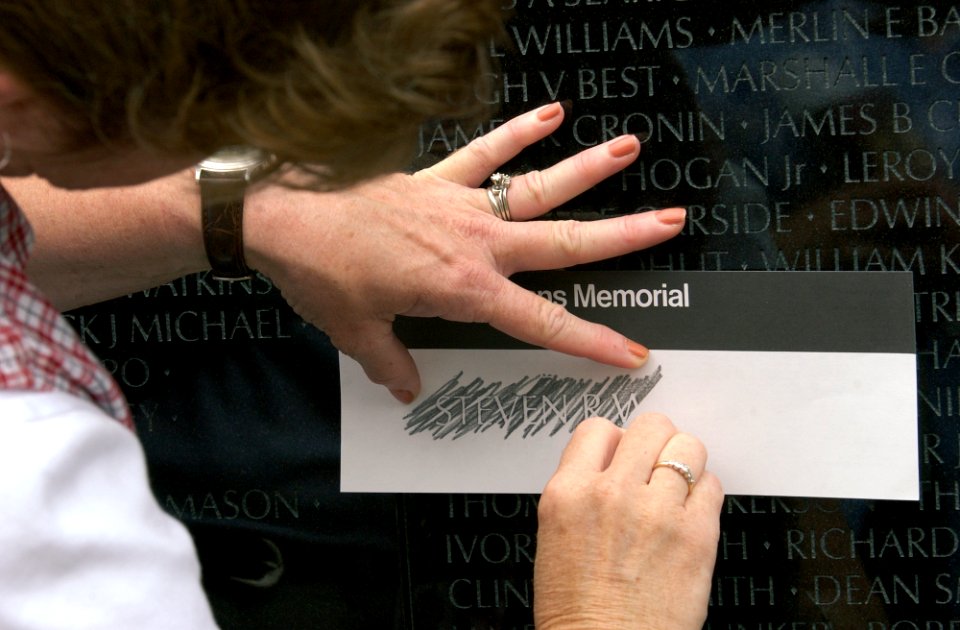 US Navy 030616-N-9593R-145 Visitors to the Vietnam Veterans Memorial Wall, take rubbings of names