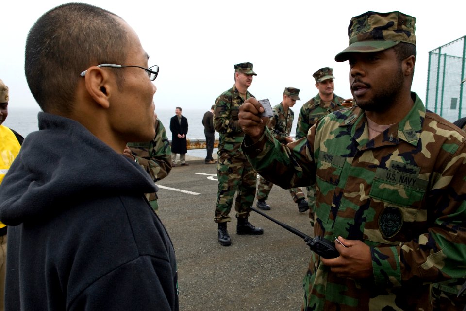US Navy 091110-N-9123L-023 Master-at-Arms 1st Class Jerry Howie questions a simulated suspect during a field training exercise