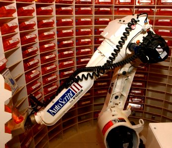 US Navy 030819-N-9593R-092 The Autoscript robot dispenses medication into a bottle at the National Naval Medical Center in Bethesda, Maryland