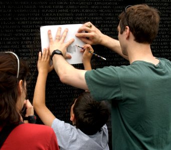 US Navy 030616-N-9593R-142 Visitors to the Vietnam Veterans Memorial Wall, take rubbings of the name, of a family member