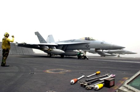 US Navy 030517-N-2385R-003 An F-A-18E Hornet, assigned to the Tophatters of Strike Fighter Squadron One Four (VFA-14), prepares to launch from one of four steam-driven catapults aboard the nuclear powered aircraft carrier USS N