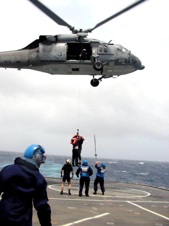 US Navy 030624-D-0000X-003 A Crewmember from the Egyptian cargo ship MV Green Glory is lowered to the flight deck of the British Royal Navy's landing ship logistic RFA Sir Tristram (L 3505), after being rescued by a U.S. Navy MH-60S Nighthawk