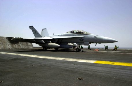 US Navy 030518-N-2385R-002 An F-A-18F Super Hornet prepares to launch from one of four steam-powered catapults on the flight deck aboard USS Nimitz (CVN 68) photo