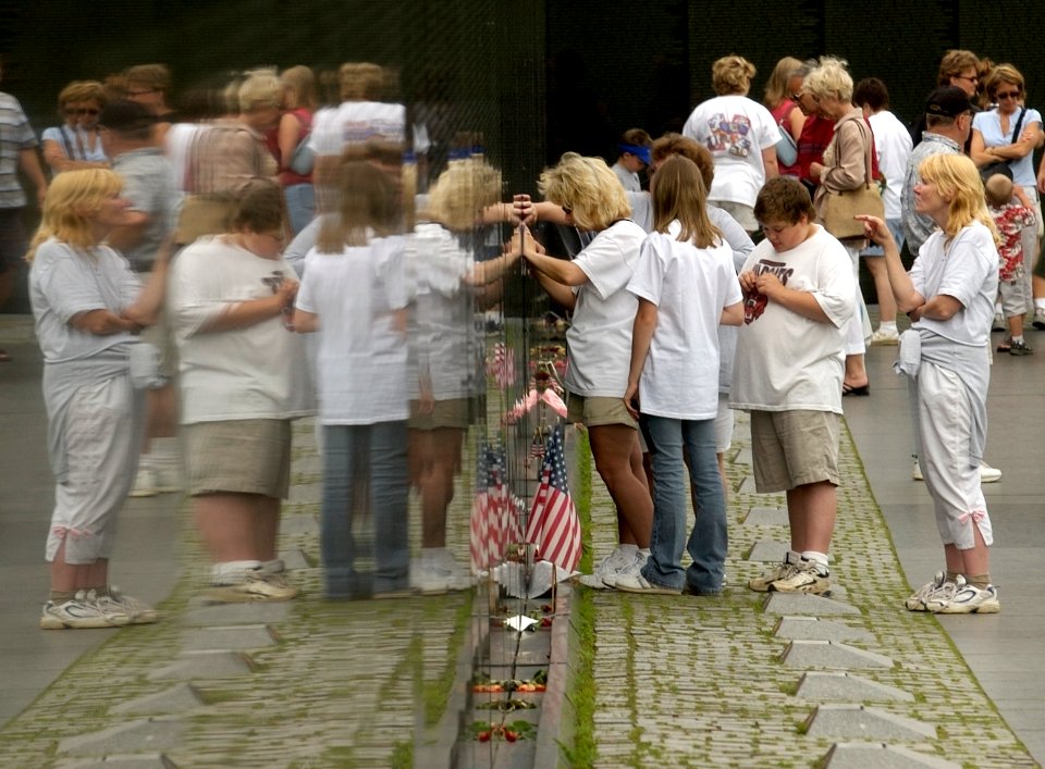 US Navy 030616-N-9593R-153 Visitors to the Vietnam Veterans Memorial Wall, take rubbings of names
