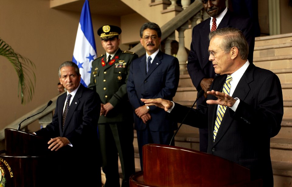 US Navy 030820-F-2828D-168 Secretary of Defense Donald H. Rumsfeld (right) answers a question from the media during a joint press conference with Honduran President Ricardo Maduro