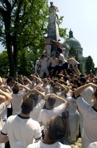 US Navy 030519-N-5319A-011 United States Naval Academy Freshman attempt climbing the Herndon Monument, a 21-foot gray obelisk covered in more than 200 pounds of lard