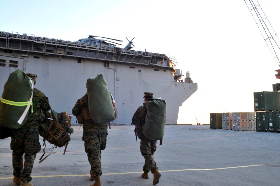 US Navy 100115-N-1831S-089 Marines ) carry gear aboard USS Bataan (LHD 5)