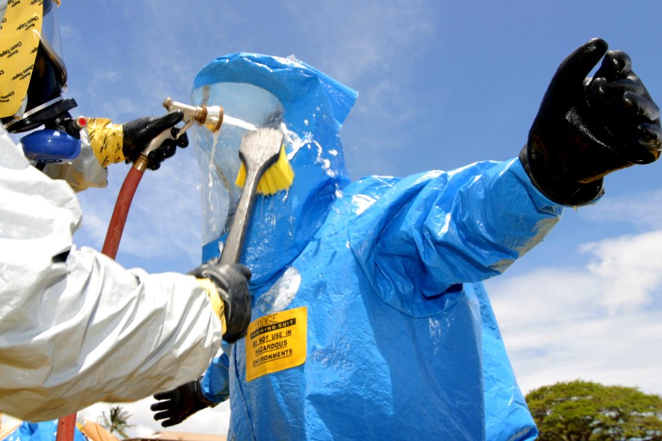 US Navy 030522-N-3228G-005 A survey team member is washed down in a decontamination line during a weapons of mass destruction exercise held on Ford Island