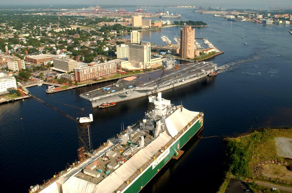 US Navy 030820-N-9851B-016 Tug boats guide USS Harry S. Truman (CVN 75) up the Elizabeth River, past Portsmouth landmarks