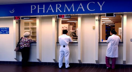 US Navy 030819-N-9593R-050 Patients and staff wait for medications at the pharmacy windows at the National Naval Medical Center in Bethesda, Maryland