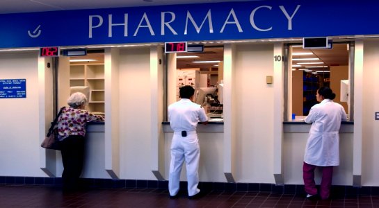 US Navy 030819-N-9593R-050 Patients and staff wait for medications at the pharmacy windows at the National Naval Medical Center in Bethesda, Maryland photo