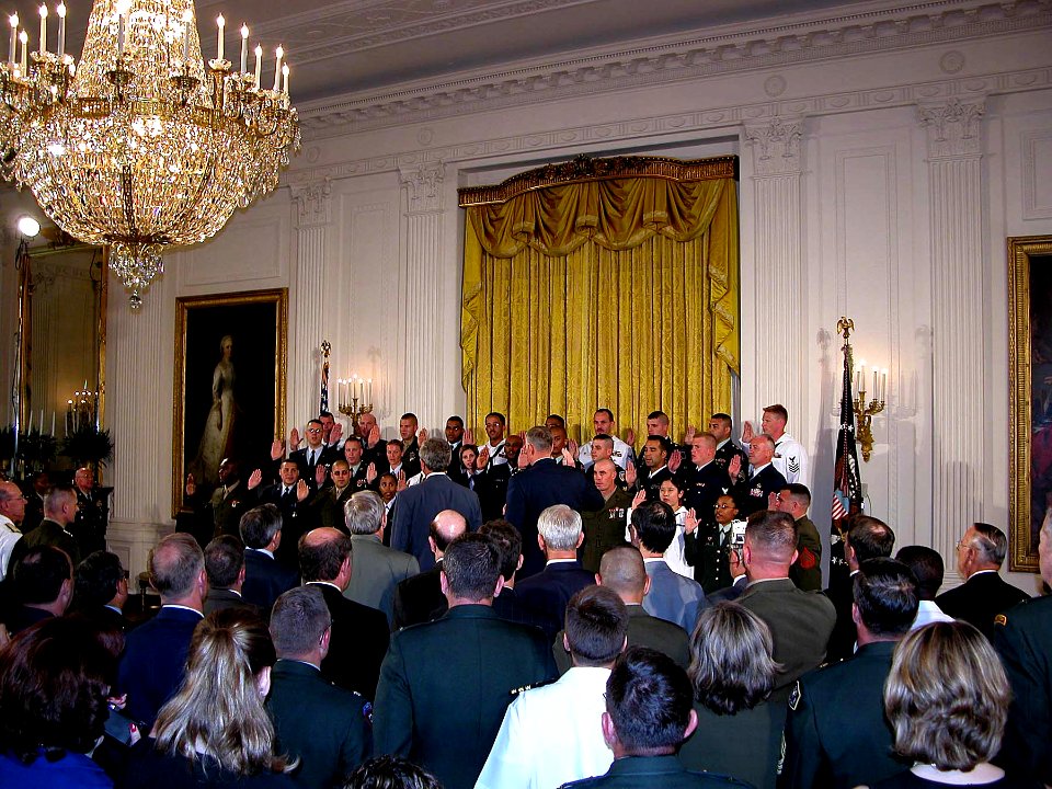 US Navy 030701-A-0000S-002 Thirty service members representing each branch of the military, including the U.S. Coast Guard, take the oath of re-enlistment administered by Air Force Gen. Richard Myers, Chairman of the Joint Chie