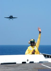 US Navy 030822-N-6278K-004 Lt., Ulysses Whitlow, from Roanoke, Ala., waves his hand to signal an unsafe flight deck aboard USS George Washington (CVN 73)
