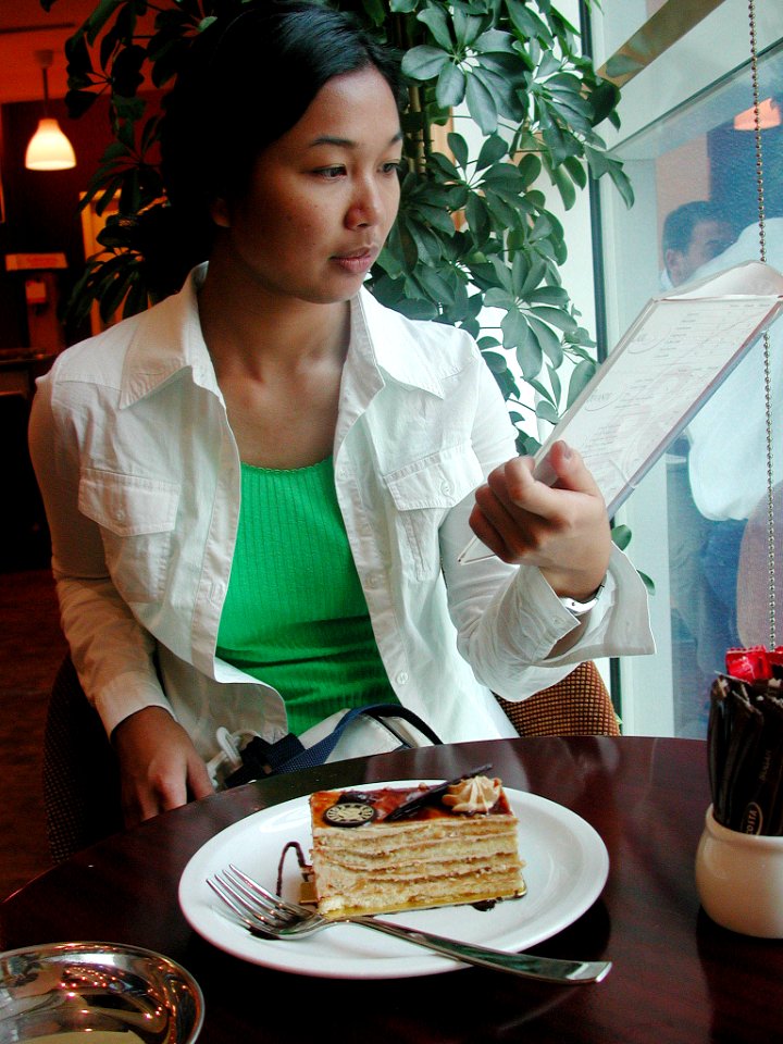 US Navy 030706-N-0413R-001 Airman Maebel Tinoko from Ewa Beach, Hawaii, enjoys dessert during a port call in United Arab Emirates