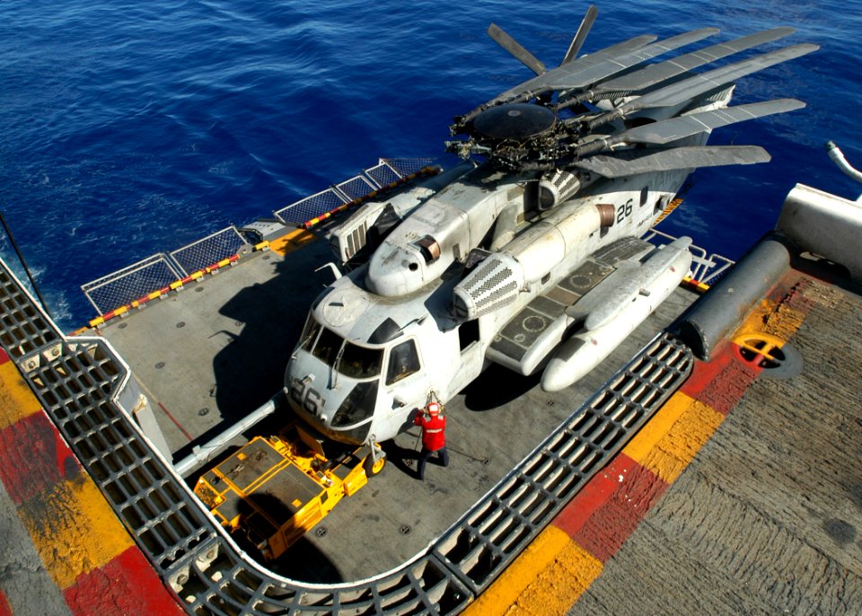 US Navy 030623-N-1512S-493 A CH-53E Super Stallion is moved from the Hangar Bay to the flight deck using the starboard elevator aboard USS Kearsarge (LHD 3)