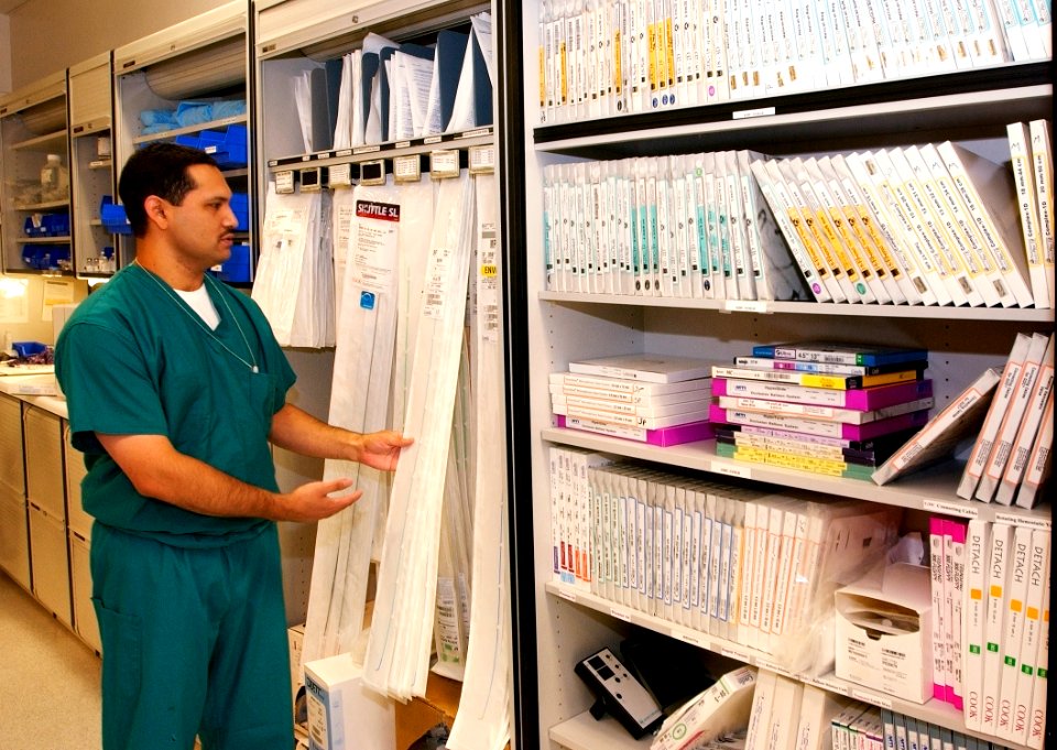 US Navy 030819-N-9593R-234 Hospital Corpsman 2nd Class Frank Castoreno talks about the different kinds of catheter tubes used by the Special Procedures section at the National Naval Medical Center