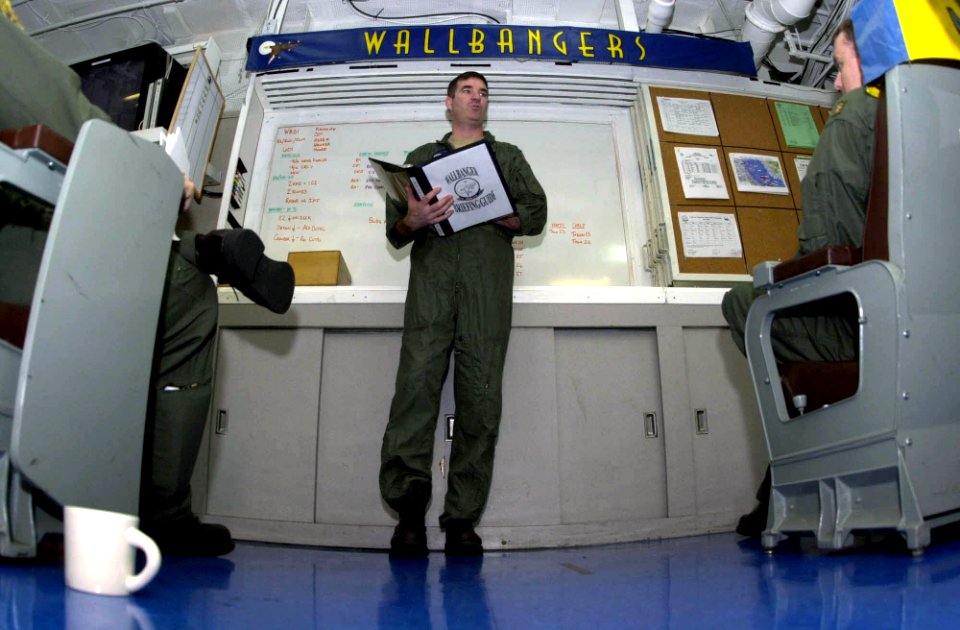 US Navy 030624-N-2385R-002 Cmdr. C.W. Plummer, Commanding Officer of Carrier Airborne Early Warning Squadron One Seventeen (VAW-117) briefs aircrew on the flight schedule for the day aboard USS Nimitz (CVN 68)