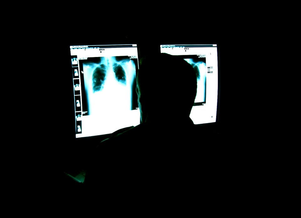 US Navy 030820-N-9593R-023 A radiologist studies digital x-rays in a viewing room at the National Naval Medical Center in Bethesda, Maryland