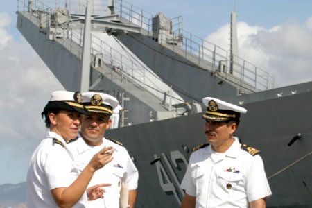 US Navy 030723-N-3228G-003 Lieutenant junior grade Erin Bailey discusses the port visit of Mexican Navy ship Usumacinta (A-412), formerly USS Frederick (LST-1184), with Mexican officers shortly after the ship's arrival in