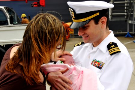 US Navy 100514-N-9123L-005 Lt. Cmdr. John Collins greets his new daughter upon the ship's return to Fleet Activities Yokosuka