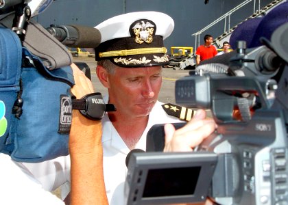 US Navy 030630-N-2972R-015 Capt. Terence E. McKnight, Commanding Officer of USS Kearsarge (LHD 3) speaks with local media immediately following the ship's homecoming photo