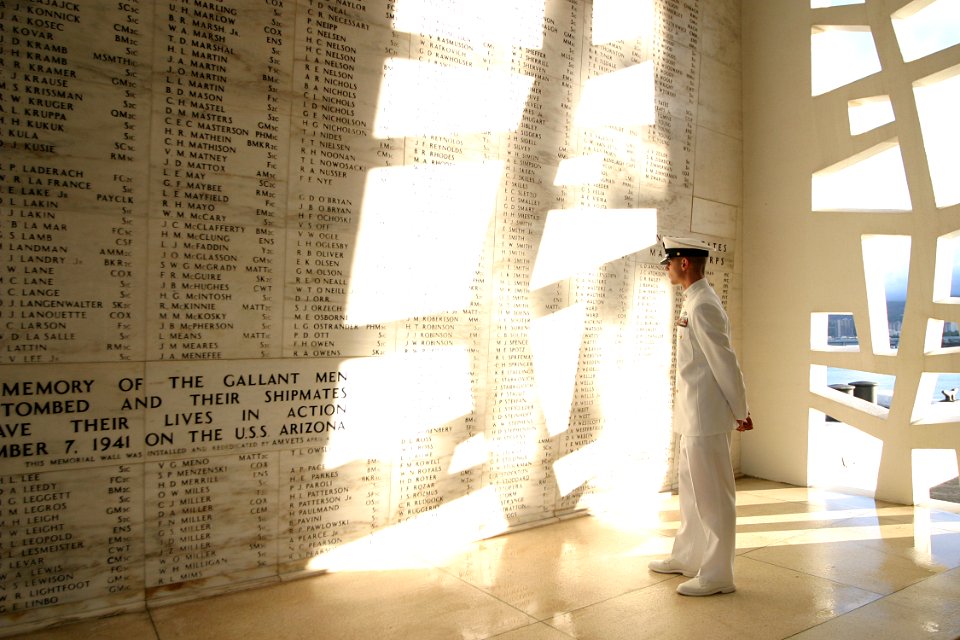 US Navy 030828-N-3228G-003 hief Journalist Tim Paynter scans the names of 1,177 Sailors and Marines who lost their lives during the Dec. 7, 1941 attack on Pearl Harbor, in the shrine room of the USS Arizona Memorial