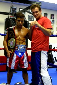 US Navy 030609-N-8784P-002 Lebron displays his 2003 U.S.A. Feather Weight Kickboxing Championship belt (left) and 2003 Virginia State Light Kickboxing Championship belt