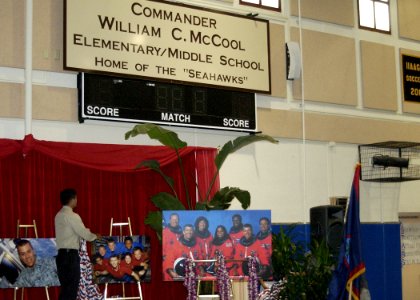US Navy 030829-N-7293M-067 Sean McCool, son of late astronaut Cmdr. William C. McCool, helps unveil a new school sign at Depart of Defense Education Activity (DODEA) Guam South School