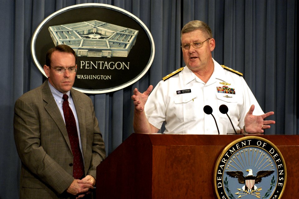 US Navy 030814-D-9880W-316 Rear Adm. John Butler responds to a technical question from a reporter during a Pentagon press briefing on the details of a newly signed contract to acquire six Virginia Class submarines