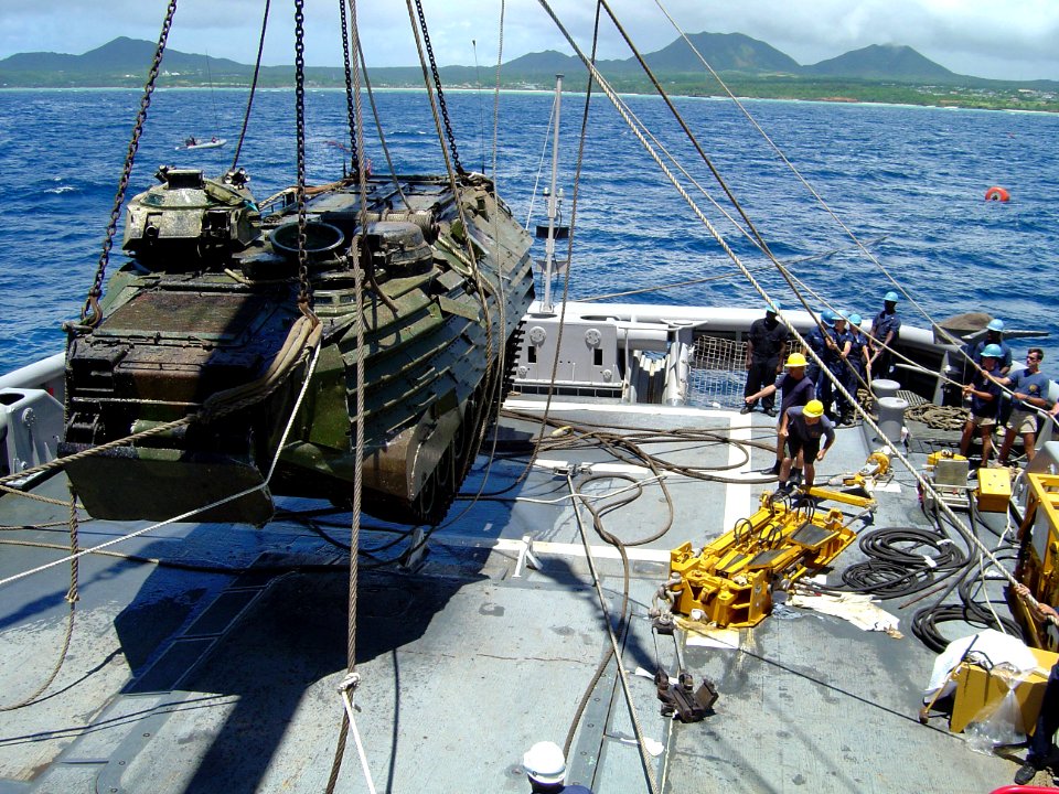 US Navy 030816-N-0000N-001 Crewmembers of USS Safeguard (ARS 50) maneuver a 26-ton Amphibious Assault Vehicle (AAV) onto its deck after recovering it from beneath more than 170 feet of water