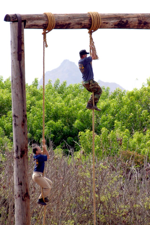 US Navy 030822-N-3228G-011 A chief petty officer selectee climbs a 50-foot rope on the confidence