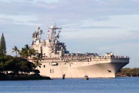 US Navy 030829-N-3228G-001 The amphibious assault ship USS Peleliu (LHA 5) transits the channel into Pearl Harbor for a short port visit photo