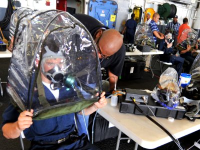US Navy 100707-N-0569K-006 Sailors fit their gas masks aboard USS Enterprise