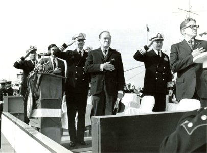 US Navy 030728-N-0000X-003 (Jan. 1971) Entertainer Bob Hope (center) and other guests salute while playing the, Star Spangled Banner during a ceremony to award Bob Hope the Distinguished Public Service Award