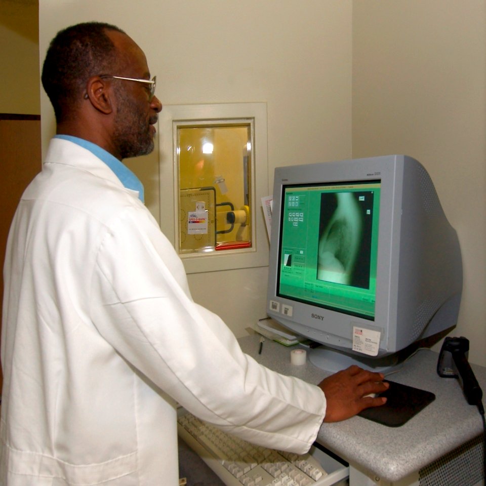 US Navy 030820-N-9593R-013 Lead x-ray technologist, James Crisler checks a recent x-ray on the monitor of a Direct Ray digital machine