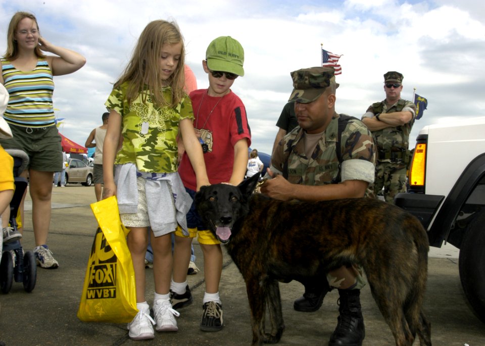 US Navy 030907-N-5783F-086 Children admire Tara, a working dog assigned to the Security Force K-9 Unit during the Naval Air Station (NAS) Oceana Regional Air Show