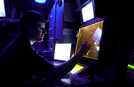 US Navy 030922-N-2143T-002 Sonar Technician 1st Class Heidi Brubaker from San Diego, Calif., plots air contacts