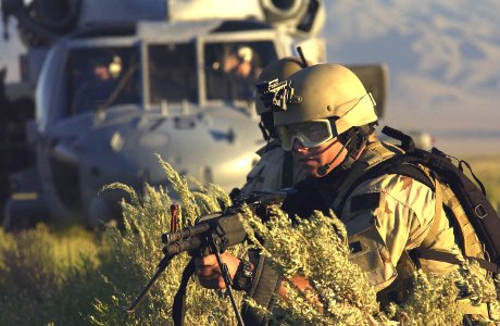 US Navy 030806-F-7823A-006 U.S. Navy SEAL (Sea, Air and Land) Team members secure a landing zone as part of a downed pilot scenario