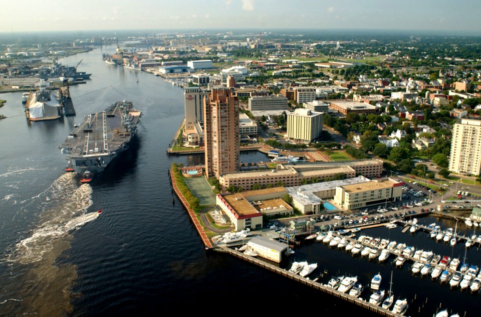 US Navy 030820-N-9851B-011 Tug boats guide USS Harry S. Truman (CVN 75) up the Elizabeth River, past Portsmouth landmarks